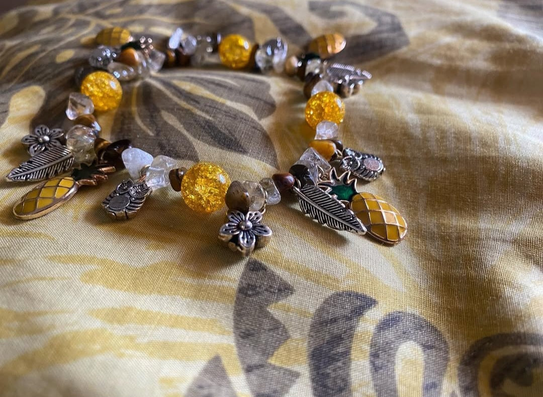 Natural Amber, Natural Tigers eye chips with yellow crackled Quartzite beads and antique silver charms, gold pineapple charms