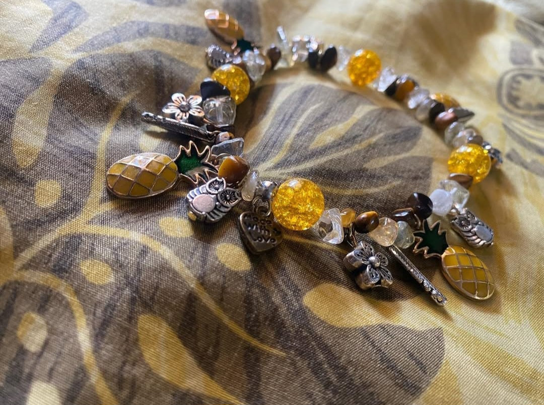 Natural Amber, Natural Tigers eye chips with yellow crackled Quartzite beads and antique silver charms, gold pineapple charms